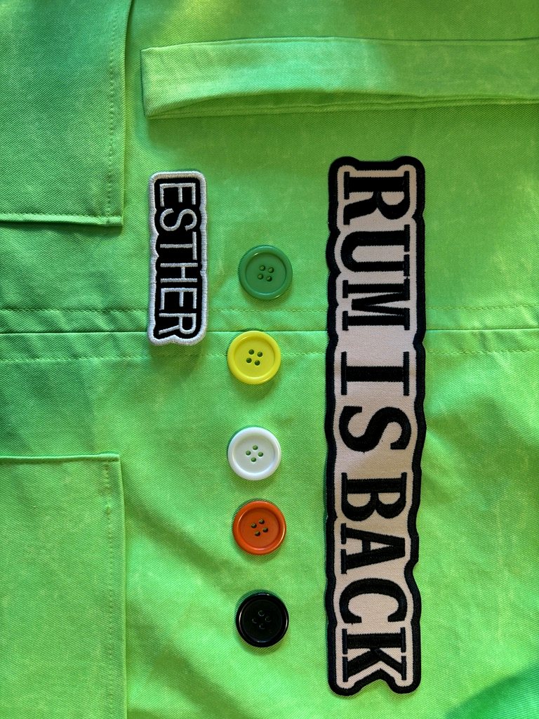 A custom green jacket with hand-applied patches and oversized buttons