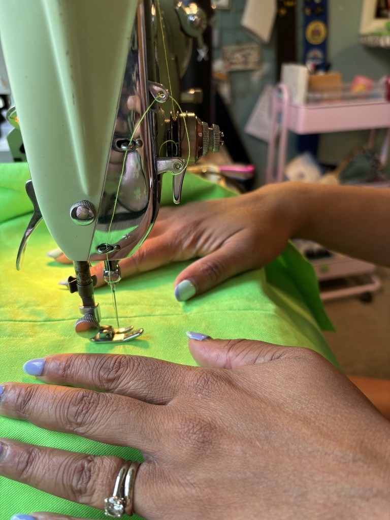 A handmade green coverall — playful custom work